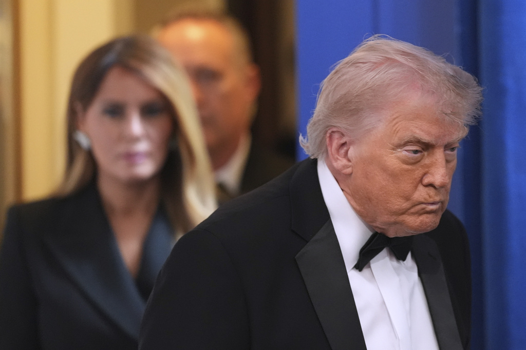 President Donald Trump with first lady Melania Trump, walks in to speak in the James Brady Press Briefing Room at the White House after an unspecified threat at the annual White House Correspondents' Association Dinner in Washington, Saturday, April 25, 2026. (AP Photo/Alex Brandon)