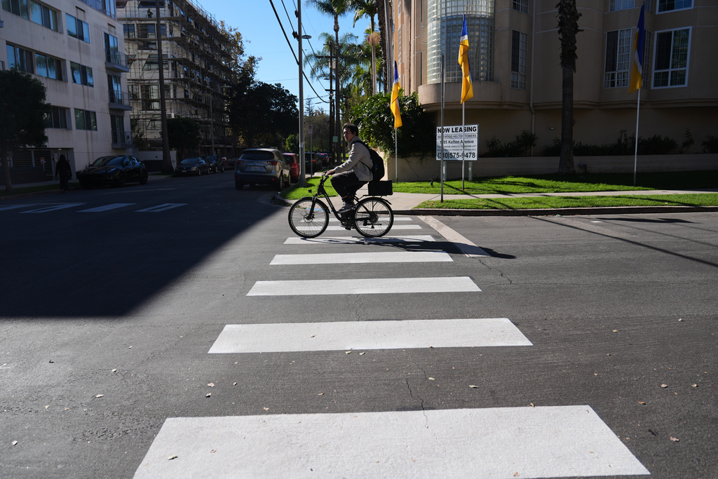 Crosswalks painted by activists are shown at the intersection of Wilkins Ave. and Kelton Ave. in the Westwood section of Los Angeles Tuesday, Dec. 9, 2025, in Los Angeles. (AP Photo/Marcio Jose Sanchez)