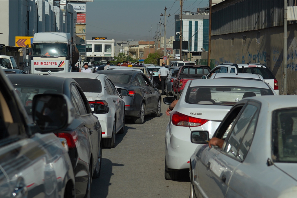 Drivers wait in a long line to get fuel at a gas station during a fuel shortage in Irbil, Iraq, Tuesday, July 28, 2026. (AP Photo/Stella Martany)