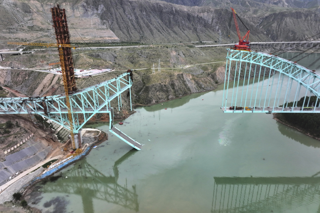 This aerial photo released by Xinhua News Agency shows the site of an under construction bridge that collapsed on the Qinghai section of the Sichuan-Qinghai Railway causing multiple dead and missing, in northwest China's Qinghai Province on Friday, Aug. 22, 2025. (Li Zhanyi/Xinhua via AP)