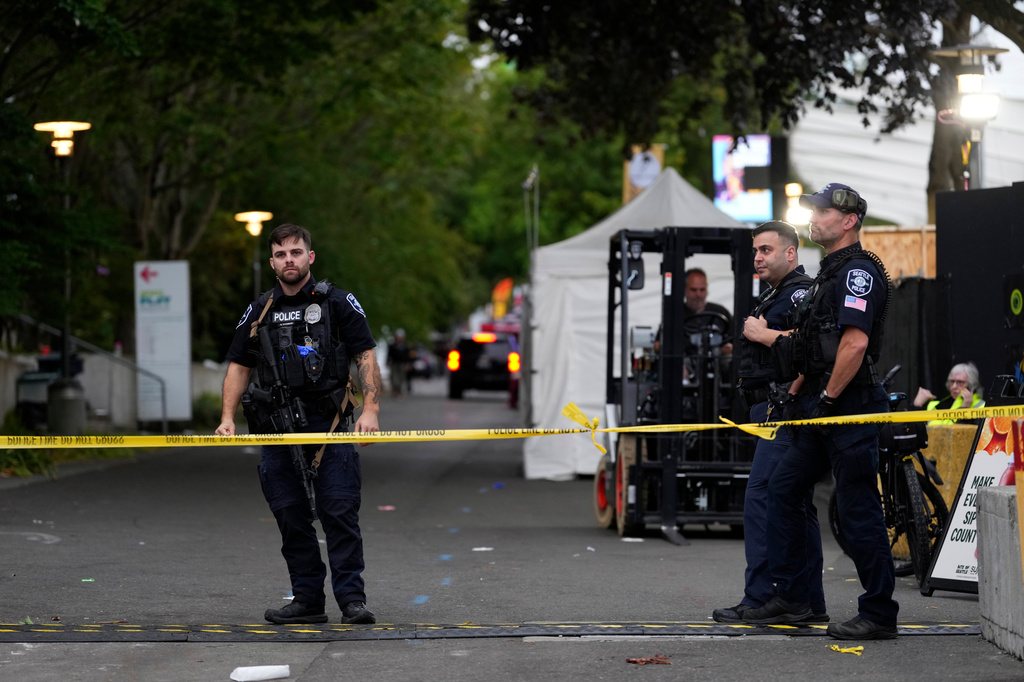 Police respond to a shooting at Seattle Center during the Bite of Seattle food festival Sunday, July 26, 2026, in Seattle, Wash. (AP Photo/Lindsey Wasson)