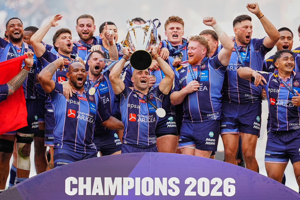 Bordeaux's Maxime Lucu lifts the trophy after winning the European Champions Cup final rugby union match between Leinster and Bordeaux in Bilbao, Spain, Saturday, May 23, 2026. (AP Photo/Miguel Oses)