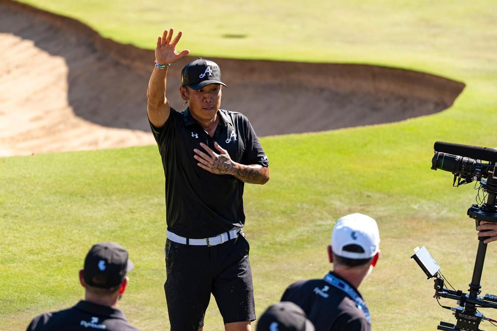 Anthony Kim of 4Aces GC waves to the fans after winning first place during the final round of the LIV Golf Adelaide at Grange Golf Club in Adelaide, Australia Sunday, Feb. 15, 2026. (Pedro Salado/LIV Golf via AP)