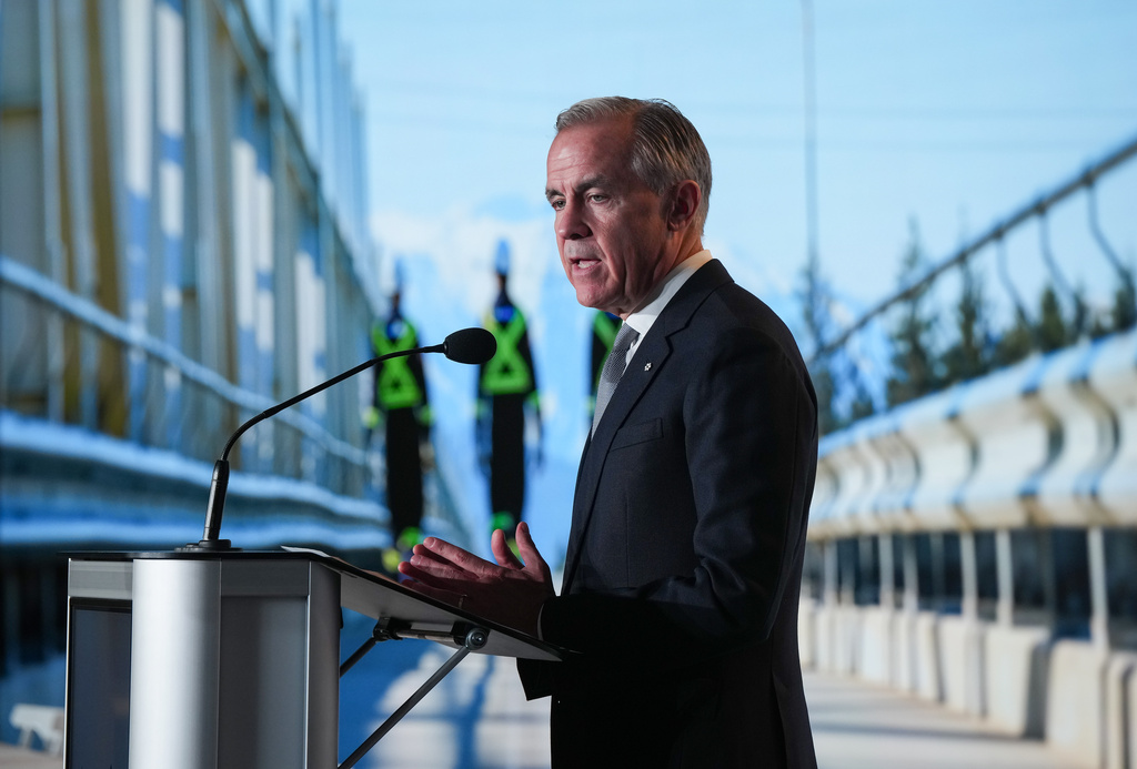 Canadian Prime Minister Mark Carney speaks after LNG Canada said it will go ahead with the Phase 2 expansion project at its LNG terminal in Kitimat, British Columbia, during an announcement in Vancouver, Tuesday, Sept. 29, 2026. (Darryl Dyck/The Canadian Press via AP)