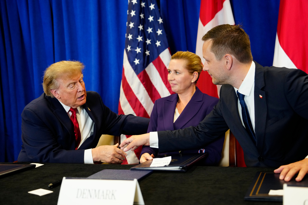 Denmark's Prime Minister Mette Frederiksen, center, Greenland's Prime Minister Jens-Frederik Nielsen, right, and US President Donald Trump at the signing ceremony of a security deal between the U.S., Denmark and Greenland at United Nations headquarters, Tuesday, Sept. 22, 2026. (Mads Claus Rasmussen/Ritzau Scanpix via AP)