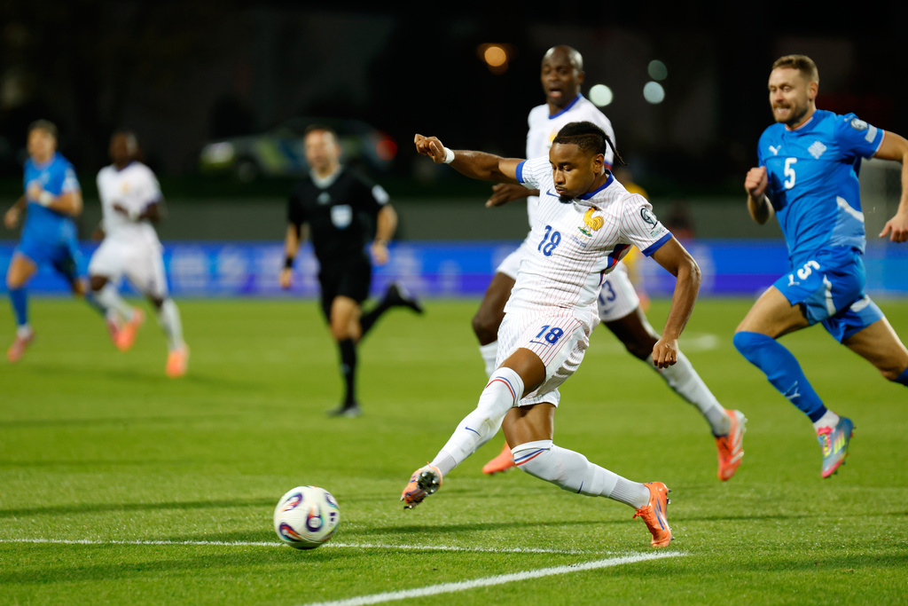 France's Christopher Nkunku passes the ball during a World Cup 2026 group D qualifying soccer match between Iceland and France in Reykjavik, Monday, Oct. 13, 2025. (AP Photo/Brynjar Gunnarsson)