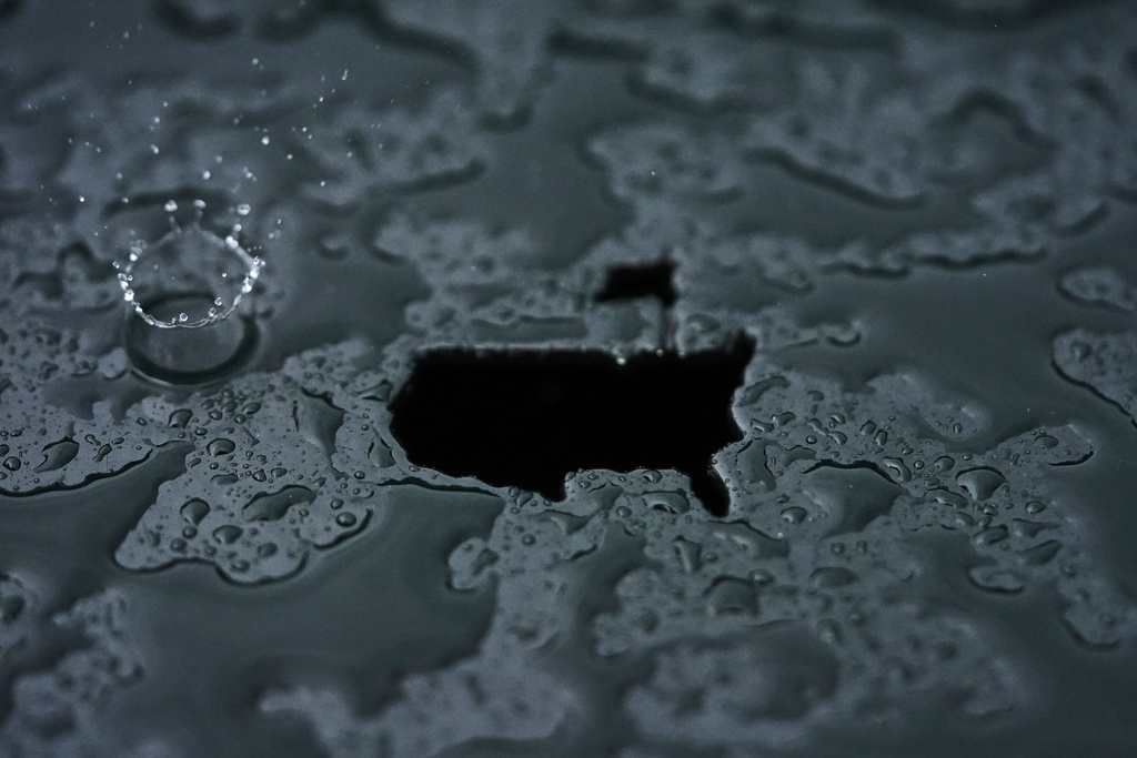A rain droplet falls on a Masters logo cut out during a practice round at the Masters golf tournament, April 7, 2025, in Augusta, Ga. (AP Photo/Matt Slocum, File)