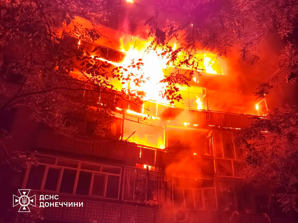 In this photo provided by the Ukrainian Emergency Service, a fire rages in a multistory building after Russia's air attack in Druzhkivka, Donetsk region, Ukraine, Wednesday, June 24, 2026. (Ukrainian Emergency Service via AP)