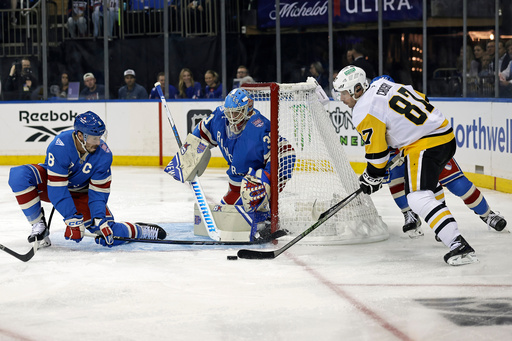 New York Rangers goaltender Igor Shesterkin and J.T. Miller (8) defend a shot by Pittsburgh Penguins center Sidney Crosby in the first period of an NHL hockey game, Tuesday, Oct. 7, 2025, in New York. (AP Photo/Adam Hunger) New York Rangers goaltender Igor Shesterkin and J.T. Miller (8) defend a shot by Pittsburgh Penguins center Sidney Crosby in the first period of an NHL hockey game, Tuesday, Oct. 7, 2025, in New York. (AP Photo/Adam Hunger)