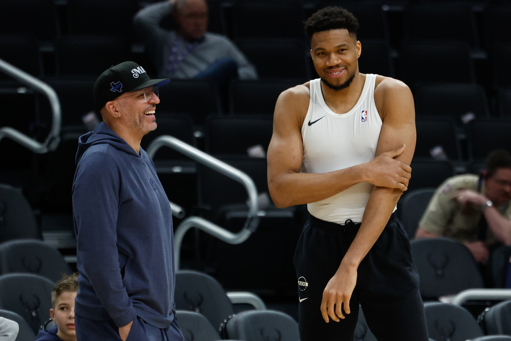 Milwaukee Bucks forward Giannis Antetokounmpo, right, talks to the Dallas Mavericks head coach Jason Kidd before an NBA basketball game Tuesday, March 31, 2026, in Milwaukee. (AP Photo/Jeffrey Phelps)
