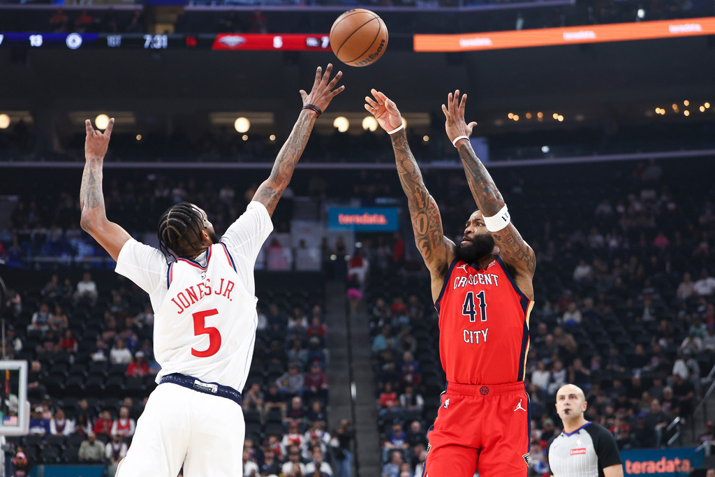 New Orleans Pelicans guard Saddiq Bey (41) shoots against Los Angeles Clippers forward Derrick Jones Jr. (5) as the referee, back right, watches during the first half of an NBA basketball game, Sunday, March 1, 2026, in Inglewood, Calif. (AP Photo/Jessie Alcheh)