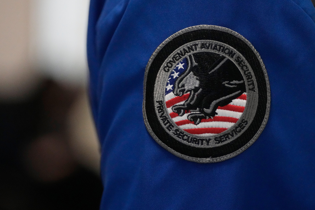 A Covenant Aviation Security Private Security Services patch is shown on an agent at San Francisco International Airport in San Francisco, Friday, Feb. 27, 2026. (AP Photo/Jeff Chiu)