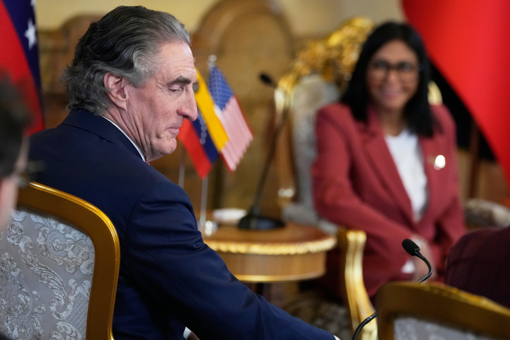 Venezuela's acting President Delcy Rodriguez, behind, and U.S. Interior Secretary Doug Burgum meet Miraflores presidential palace in Caracas, Venezuela, Wednesday, March 4, 2026. (AP Photo/Ariana Cubillos)