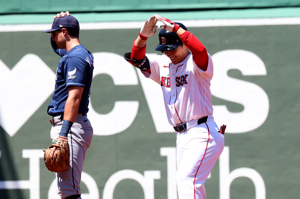 Boston Red Sox designated hitter Masataka Yoshida reacts after hitting a double during the second inning of the first baseball game of a doubleheader against the Tampa Bay Rays, Friday, July 17, 2026, in Boston. (AP Photo/Mark Stockwell)