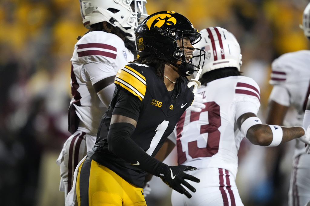 Iowa wide receiver KJ Parker (1) celebrates after catching a touchdown pass during the second half of an NCAA college football game against Massachusetts, Saturday, Sept. 13, 2025, in Iowa City, Iowa. (AP Photo/Charlie Neibergall)