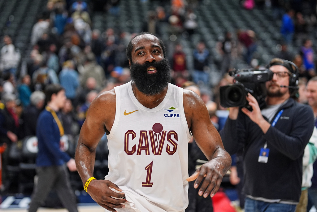 Cleveland Cavaliers guard James Harden smiles as he heads off the court after being interviewed following the Cavaliers' victory over the Denver Nuggets in an NBA basketball game Monday, Feb. 9, 2026, in Denver. (AP Photo/David Zalubowski)
