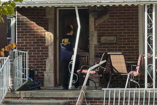 An FBI agent enters a home in a Dearborn, Mich., neighborhood on Friday, Oct. 31, 2025. (AP Photo/Mike Householder) An FBI agent enters a home in a Dearborn, Mich., neighborhood on Friday, Oct. 31, 2025. (AP Photo/Mike Householder)
