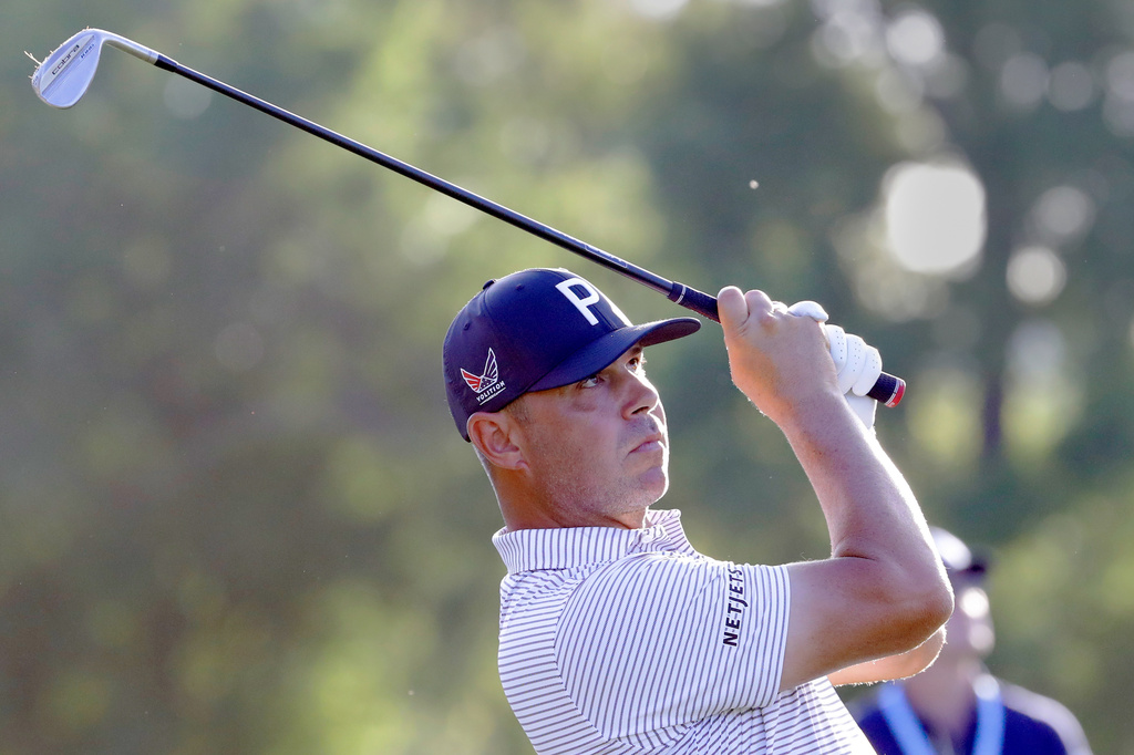 Gary Woodland watches his tee shot on the ninth hole during the first round of the Texas Children's Houston Open golf tournament Thursday, March 26, 2026, in Houston. (AP Photo/Michael Wyke)
