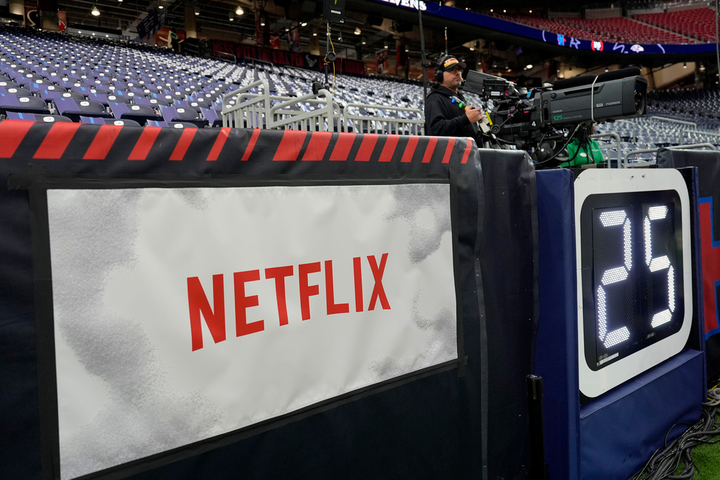 FILE - A Netflix banner is seen before an NFL football game between the Houston Texans and the Baltimore Ravens, Dec. 25, 2024, in Houston. (AP Photo/David J. Phillip, File)