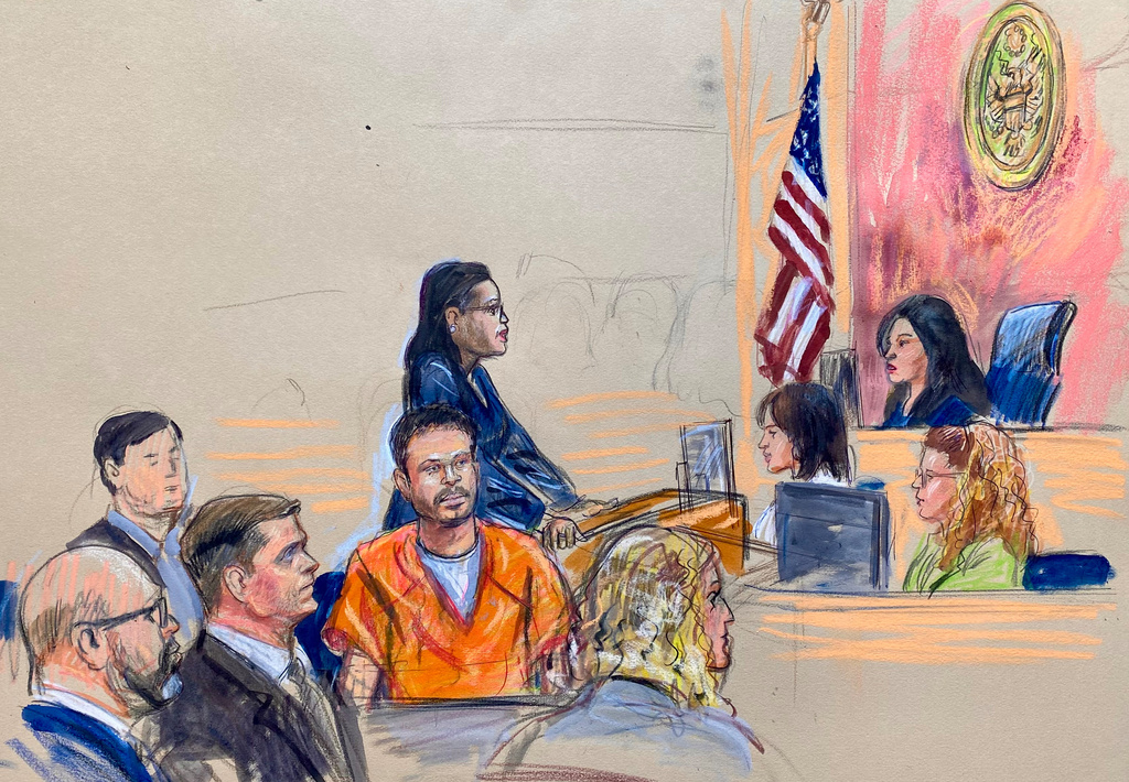 This courtroom sketch depicts Cole Tomas Allen, seated center, the California man arrested in the shooting incident at the correspondents dinner in Washington, seen appearing before U.S. Magistrate Moxila Upadhyaya, in federal court, Thursday, April 30, 2026 in Washington. (Dana Verkouteren via AP)
