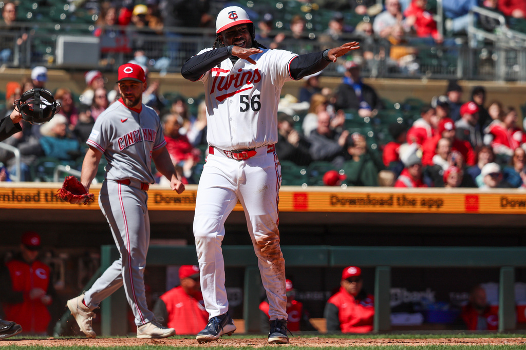 Minnesota Twins' Josh Bell celebrates after scoring during the fifth inning of a baseball game against the Cincinnati Reds ,Saturday, April 18, 2026, in Minneapolis. (AP Photo/Ellen Schmidt)