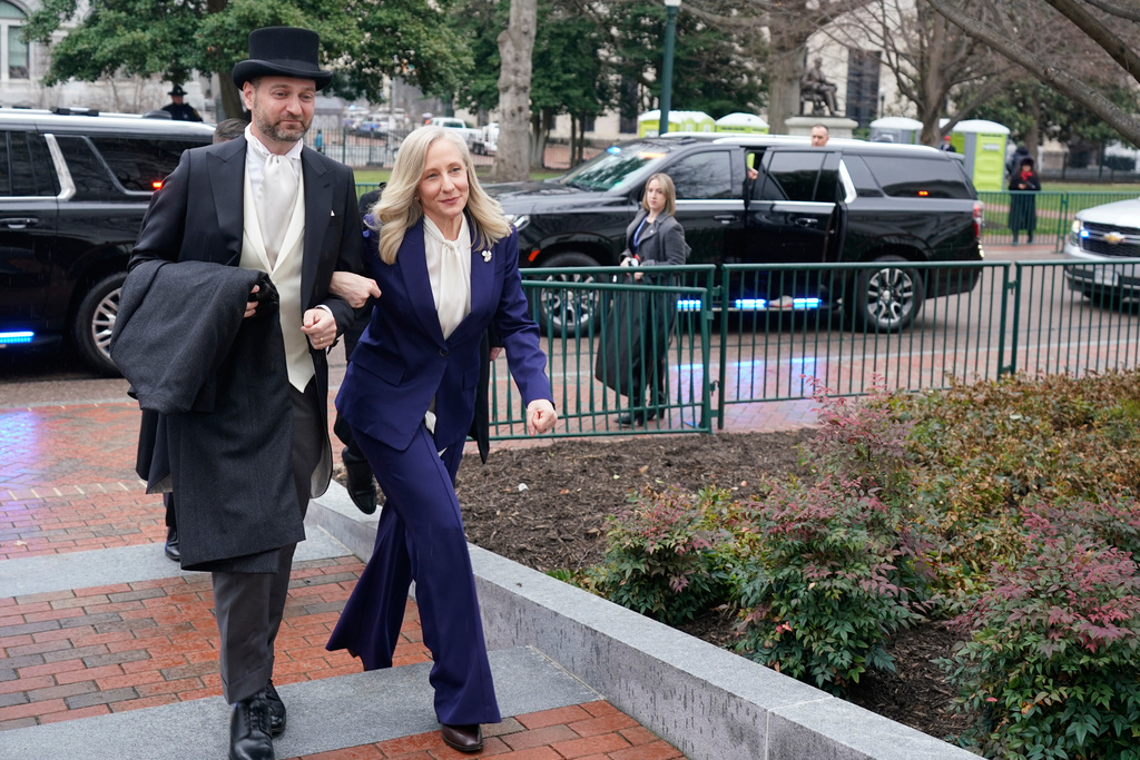 Virginia Gov. Abigail Spanberger arrives with her husband Adam Spanberger, at the Capitol in Richmond Va., Saturday Jan. 17, 2026. (AP Photo/Steve Helber, Pool)