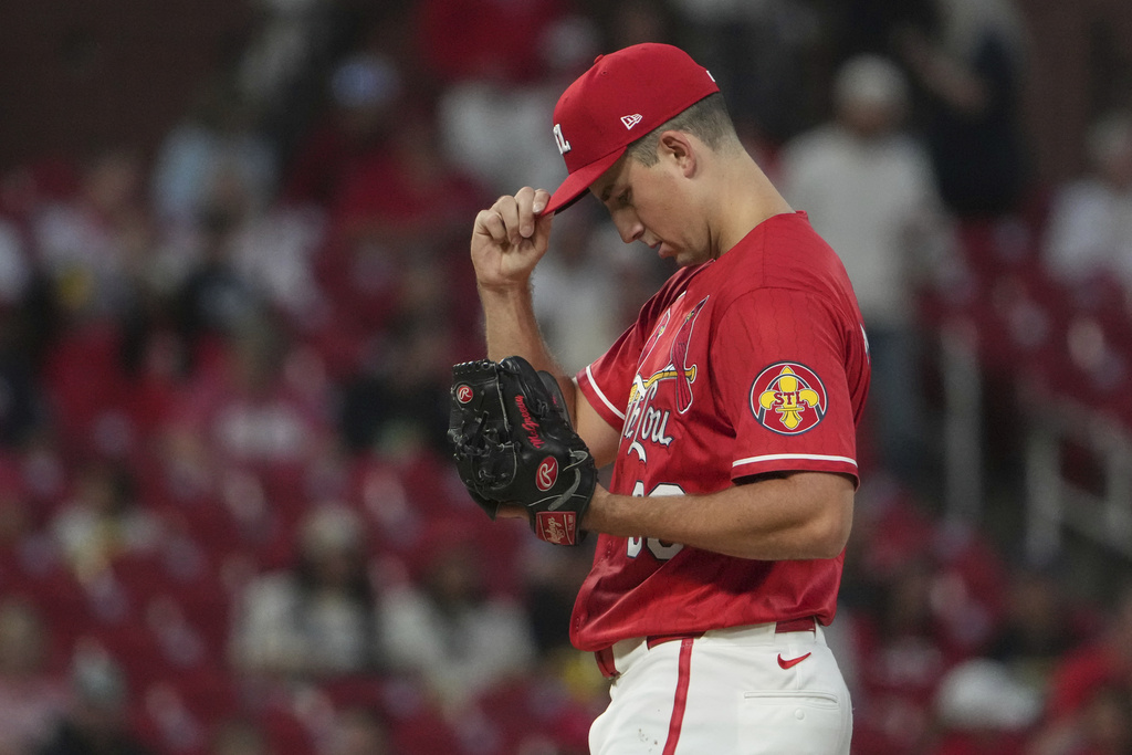 St. Louis Cardinals starting pitcher Michael McGreevy adjusts his cap after giving up a solo home run to San Francisco Giants' Rafael Devers during the first inning of a baseball game Friday, Sept. 5, 2025, in St. Louis. (AP Photo/Jeff Roberson)