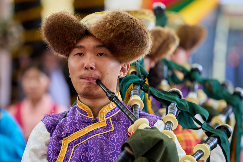 Exiled Tibetans in a traditional costume play the bagpipes during the birthday celebrations of Tibetan spiritual leader the Dalai Lama at the Tsuglakhang temple in Dharamshala, India, Monday, July 6, 2026. (AP Photo/Ashwini Bhatia)