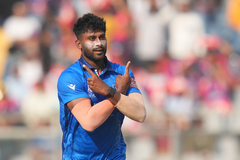 Italy's Crishan Kalugamage celebrates the wicket of Nepal's Gulshan Jha during the T20 World Cup cricket match between Italy and Nepal in Mumbai, India, Thursday, Feb. 12, 2026. (AP Photo/Rafiq Maqbool)