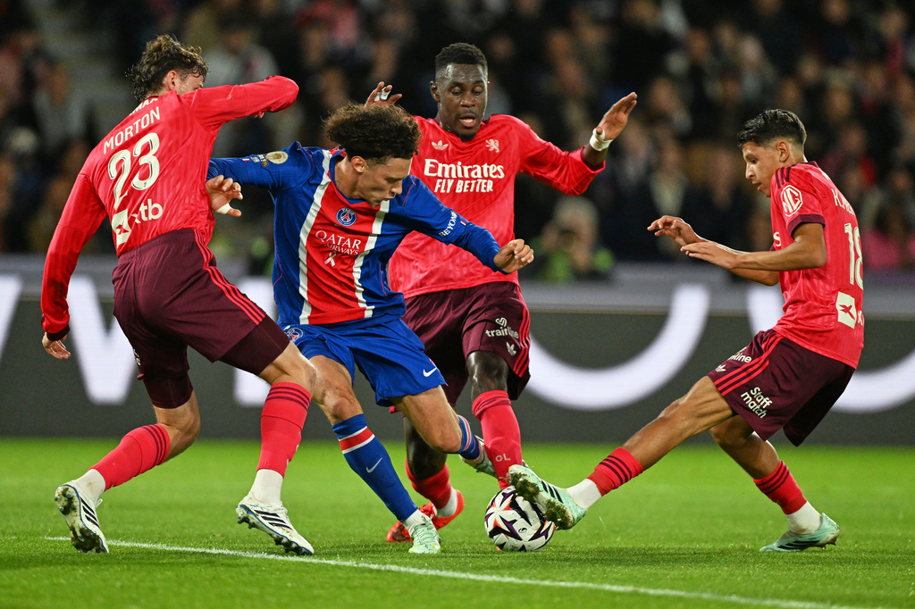 PSG's Maghnes Akliouche, centre, in action during the French League One soccer match between Paris Saint-Germain and Lyon in Paris, Monday, Oct. 26, 2026. (AP Photo/Emma Da Silva)