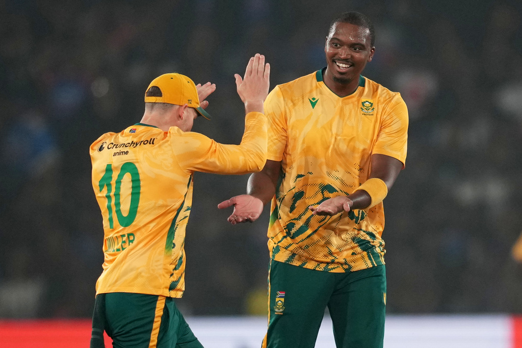 South Africa's Lungi Ngidi, right, celebrates with teammate the wicket of India's captain Suryakumar Yadav during the first T20 International cricket match between India and South Africa in Cuttack, India, Tuesday, Dec. 9, 2025. (AP Photo/Rafiq Maqbool)
