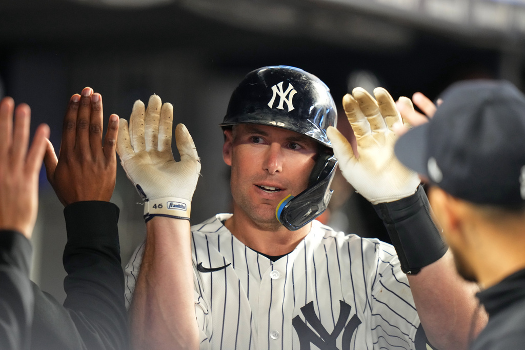 New York Yankees' Paul Goldschmidt celebrates with teammates after hitting a home run during the eighth inning of a baseball game against the Texas Rangers Tuesday, May 5, 2026, in New York. (AP Photo/Frank Franklin II)