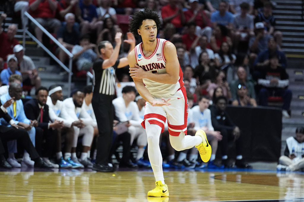 Arizona guard Brayden Burries celebrates after making a 3-point basket against LIU during the first half in the first round of the NCAA college basketball tournament, Friday, March 20, 2026, in San Diego. (AP Photo/Marcio Jose Sanchez)