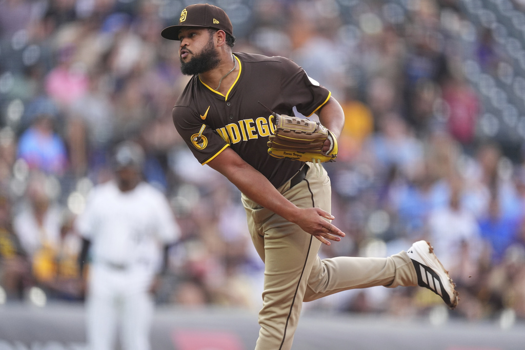 San Diego Padres starting pitcher Randy Vasquez works against the Colorado Rockies in the first inning of a baseball game Saturday, Sept. 6, 2025, in Denver. (AP Photo/David Zalubowski)