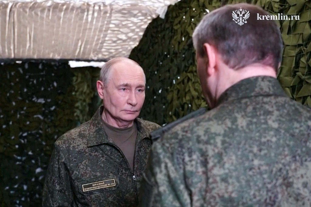 In this image taken from video provided by Russian Presidential Press Service on Friday, July 3, 2026. Russian President Vladimir Putin, left, listens to a report of Russian Chief of General Staff Gen. Valery Gerasimov as he visits one of the command posts of the Joint Group of the Russian Forces, in an undisclosed location. (Russian Presidential Press Service via AP)