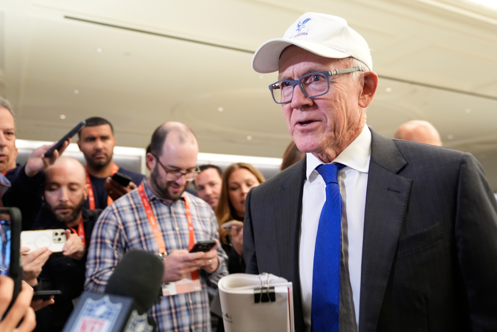 New York Jets owner Woody Johnson talks to reporters before attending an NFL owners meeting in New York, Tuesday, Oct. 21, 2025. (AP Photo/Seth Wenig)