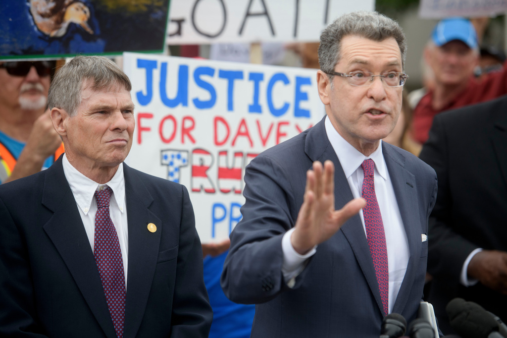 Former Olympic canoeist David Hearn, left, listens as his attorney Norman Eisen, right, speaks after he pleaded not guilty to allegedly damaging the Lincoln Memorial Reflecting Pool, Thursday, July 9, 2026, in Washington. (AP Photo/Rod Lamkey, Jr.)