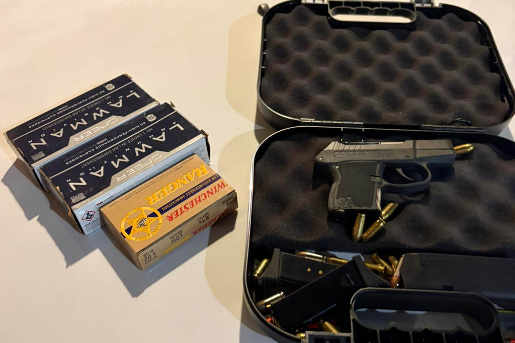 This photo provided by the Okaloosa County Sheriff's Office on Thursday, April 23, 2026, shows a handgun and ammunition recovered from Christopher Gillum's room after he was arrested at a hotel in Destin, Fla. (Okaloosa County Sheriff's Office via AP)