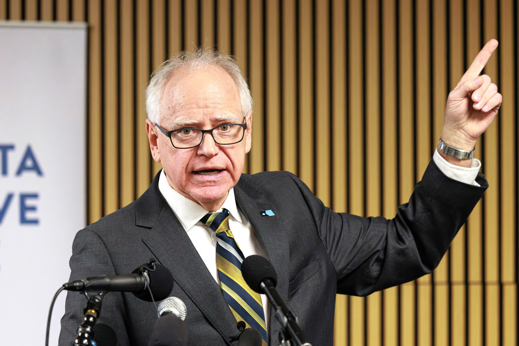 Minnesota Gov. Tim Walz responds to questions from reporters regarding whether he will seek a third term during a press conference following an event on the state's new Paid Family and Medical Leave program, Tuesday, Jan. 6, 2026, in Minneapolis. (Kerem Yücel/Minnesota Public Radio via AP)