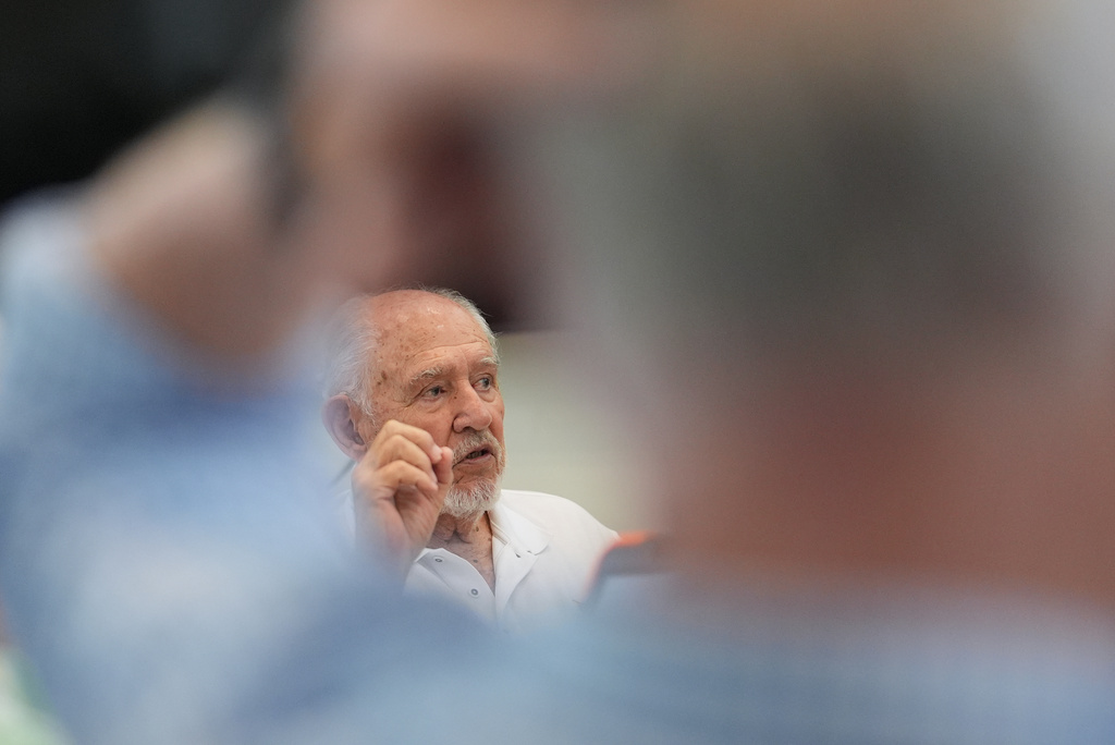 Rafael Montalvo, president of the Brigade 2506 Veterans Association, speaks with other Bay of Pigs Invasion veterans and relatives during a planning meeting for the reopening of the Bay of Pigs Museum in a new and larger space in Miami's Little Havana neighborhood, Tuesday, April 7, 2026. (AP Photo/Rebecca Blackwell)
