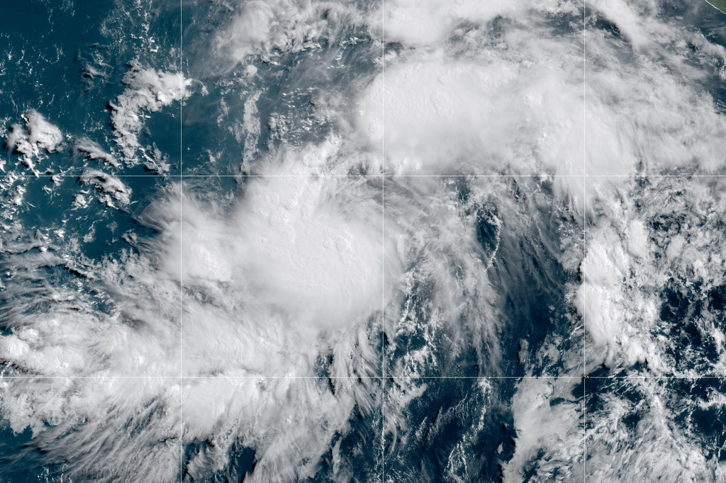 This GOES-19 GeoColor satellite image provided by NOAA shows Tropical Storm Genevieve in the Eastern Pacific on Friday, July 24, 2026. (NOAA via AP)