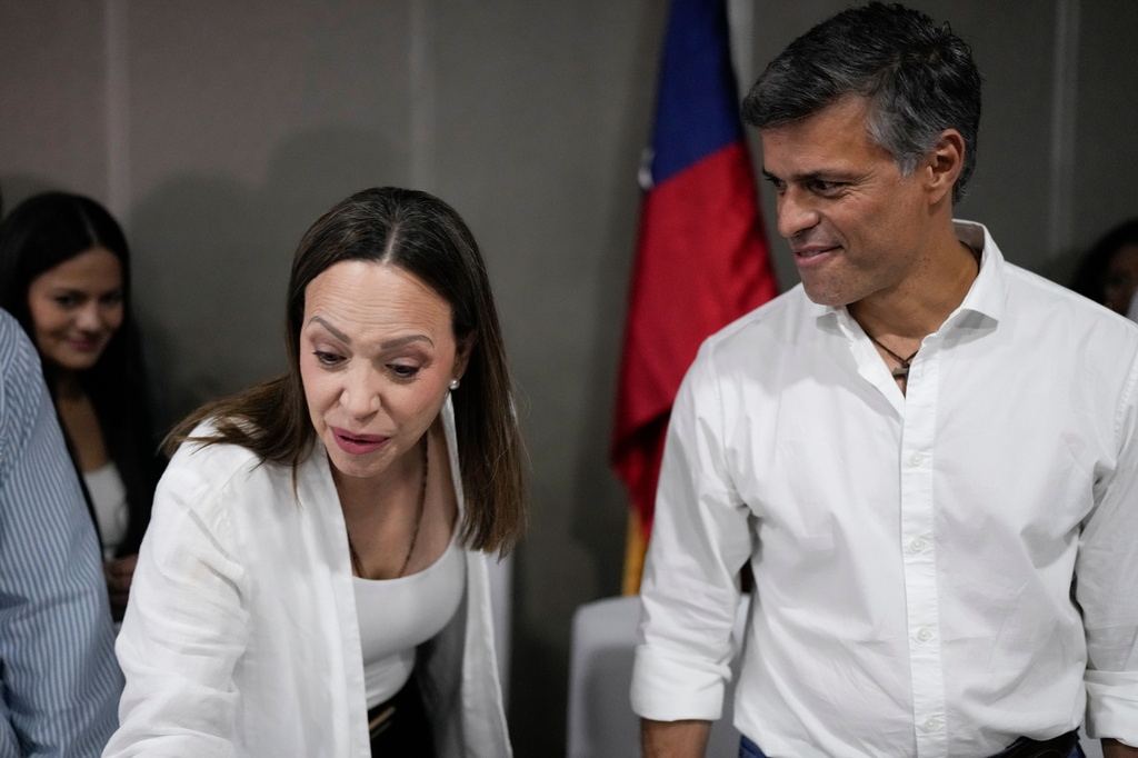 Venezuela's opposition activist Leopoldo Lopez, right, looks at opposition leader Maria Corina Machado after a press conference in Panama City, Saturday, May 23, 2026. (AP Photo/Matias Delacroix)