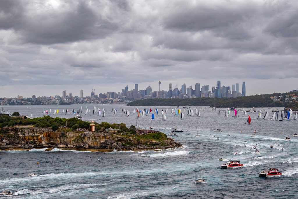 In this photo provided by the Cruising Yacht Club of Australia, competitors make a start in the Sydney Hobart yacht race in Sydney, Friday, Dec. 26, 2025. (Kurt Arrigo/CYCA via AP)