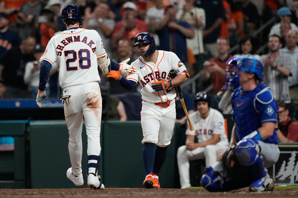 Houston Astros' Braden Shewmake (28) celebrates with Jose Altuve after hitting a home run during the third inning of a baseball game against the Los Angeles Dodgers in Houston, Tuesday, May 5, 2026. (AP Photo/Ashley Landis)