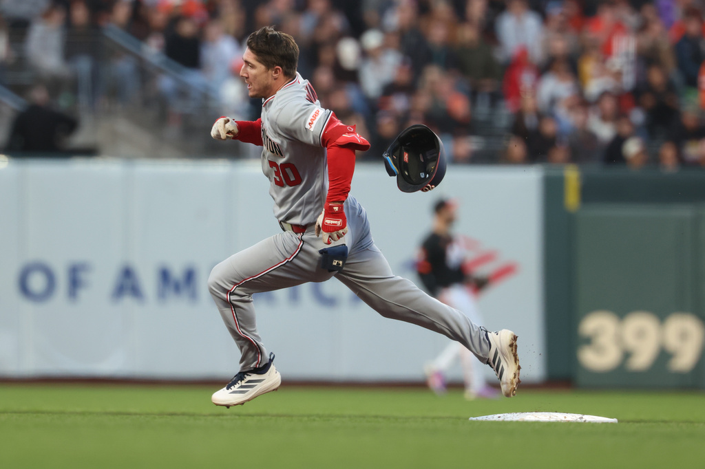 Washington Nationals' Jacob Young rounds the bases after hitting a triple against the San Francisco Giants during the fifth inning of a baseball game in San Francisco, Tuesday, June 9, 2026. (AP Photo/Jed Jacobsohn)