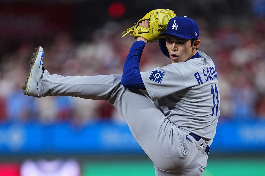 Los Angeles Dodgers' Roki Sasaki pitches during the ninth inning in Game 1 of baseball's National League Division Series against the Philadelphia Phillies, Saturday, Oct. 4, 2025, in Philadelphia. (AP Photo/Matt Rourke)