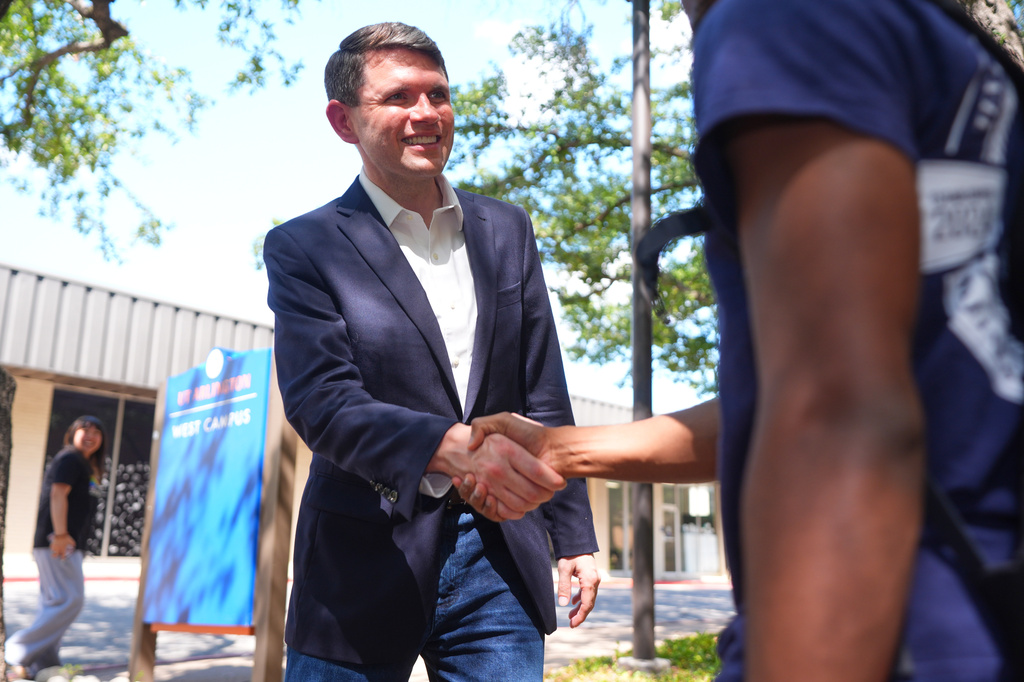 Democratic Senate candidate James Talarico, left, shakes hands after a news conference at UTA, Sunday, Aug. 30, 2026, in Arlington, Texas. (AP Photo/LM Otero)