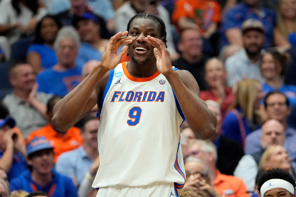 FILE - Florida center Rueben Chinyelu (9) celebrates during the second half in the first round of the NCAA college basketball tournament against Prairie View A&M on March 20, 2026, in Tampa, Fla. (AP Photo/Chris O'Meara, File)