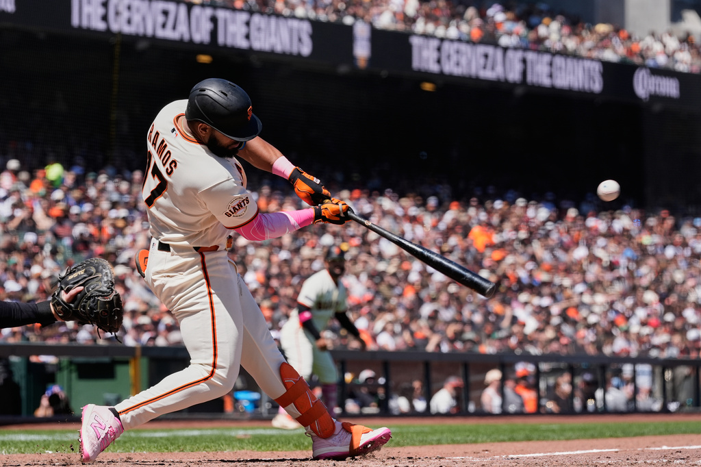 San Francisco Giants' Heliot Ramos hits an RBI double during the sixth inning of a baseball game against the Pittsburgh Pirates, Sunday, May 10, 2026, in San Francisco. (AP Photo/Godofredo A. Vásquez)