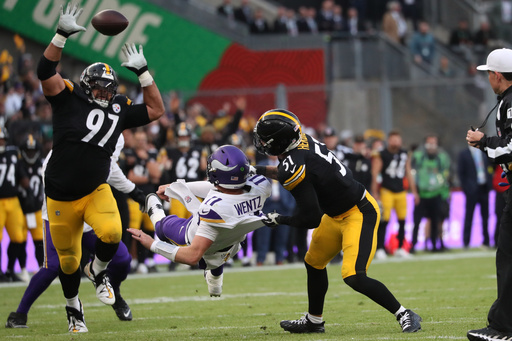 Pittsburgh Steelers defensive tackle Cameron Heyward (97), left, Pittsburgh Steelers linebacker Nick Herbig (51) and Minnesota Vikings quarterback Carson Wentz (11),center, challenge for the ball during the NFL football game between Minnesota Vikings and Pittsburgh Steelers at Croke Park stadium in Dublin, Sunday, Sept. 28, 2025.(AP Photo/Peter Morrison) Pittsburgh Steelers defensive tackle Cameron Heyward (97), left, Pittsburgh Steelers linebacker Nick Herbig (51) and Minnesota Vikings quarterback Carson Wentz (11),center, challenge for the ball during the NFL football game between Minnesota Vikings and Pittsburgh Steelers at Croke Park stadium in Dublin, Sunday, Sept. 28, 2025.(AP Photo/Peter Morrison)